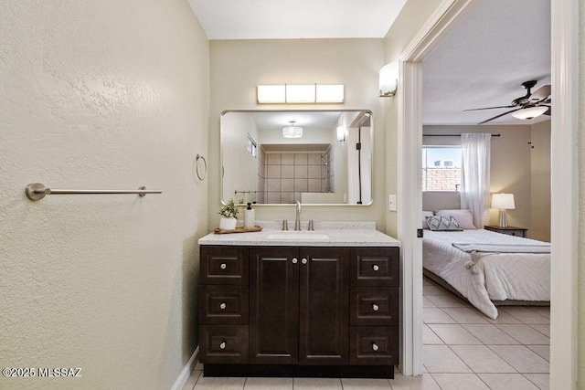 bathroom featuring vanity, tile patterned floors, and ceiling fan