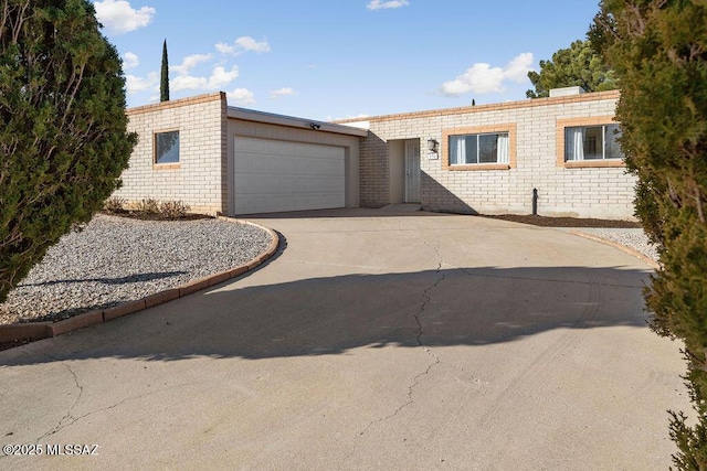 single story home featuring a garage