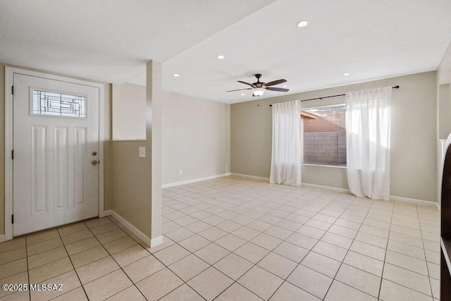 tiled entryway with ceiling fan