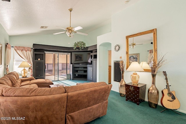 carpeted living room with ceiling fan, lofted ceiling, and a textured ceiling