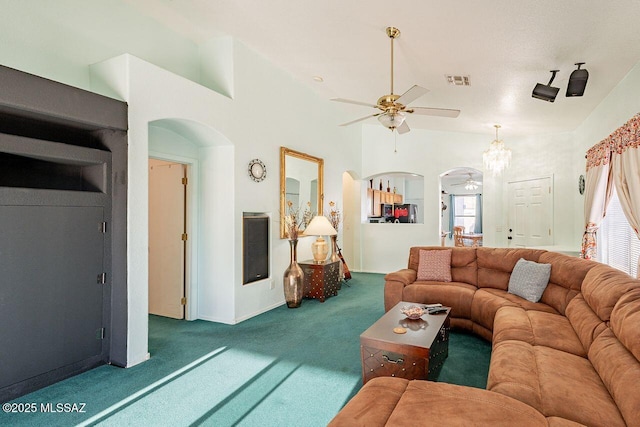 carpeted living room featuring a wealth of natural light and ceiling fan