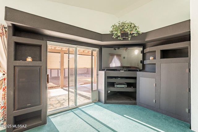 unfurnished living room featuring carpet floors