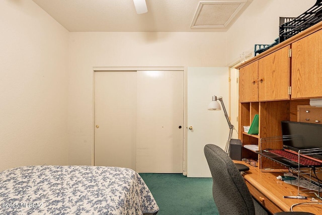 bedroom with ceiling fan, dark carpet, and a closet