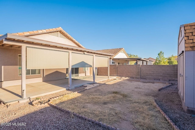 rear view of property featuring a patio