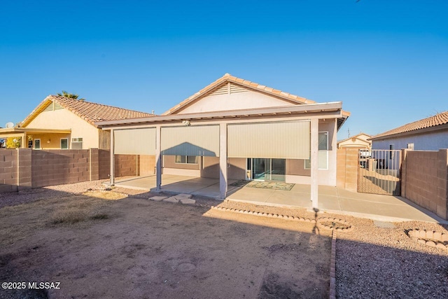 rear view of property featuring a patio area