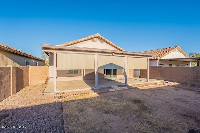 back of property featuring a patio