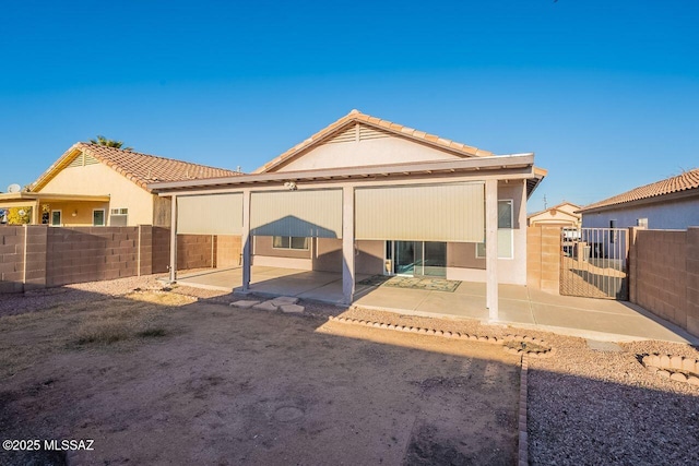 rear view of property with a patio area