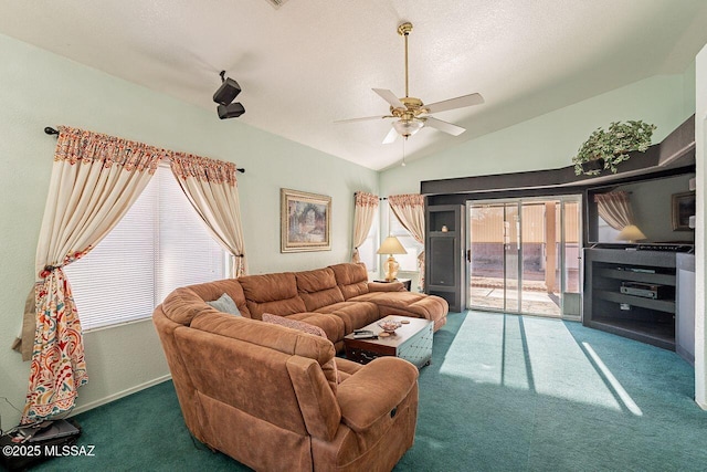 carpeted living room featuring lofted ceiling, ceiling fan, and a textured ceiling