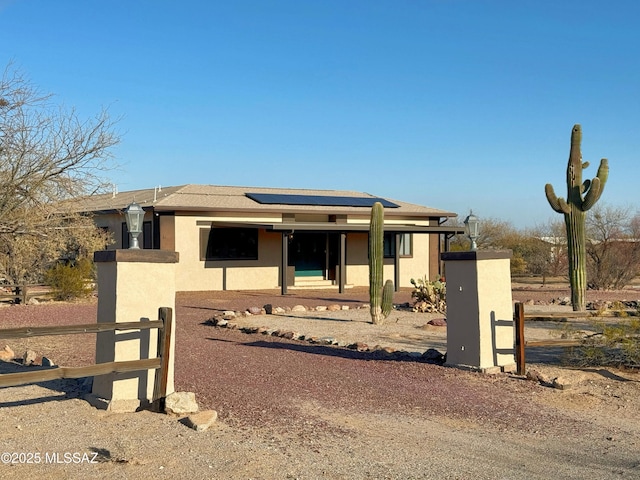 prairie-style house with solar panels