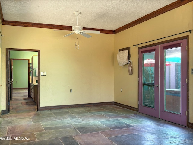 empty room with ceiling fan, crown molding, french doors, and a textured ceiling