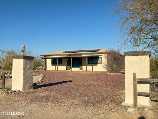 view of front of home with solar panels