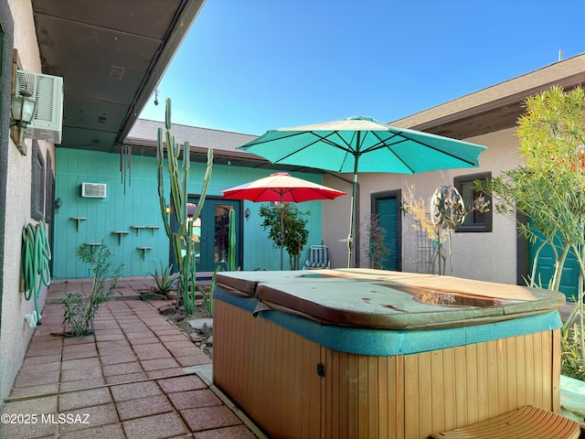 view of patio with a hot tub