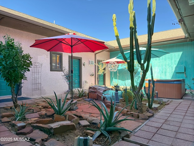 exterior space featuring a hot tub