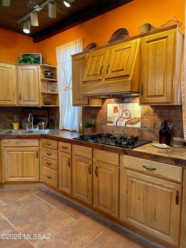 kitchen featuring wood ceiling, black gas cooktop, sink, and backsplash