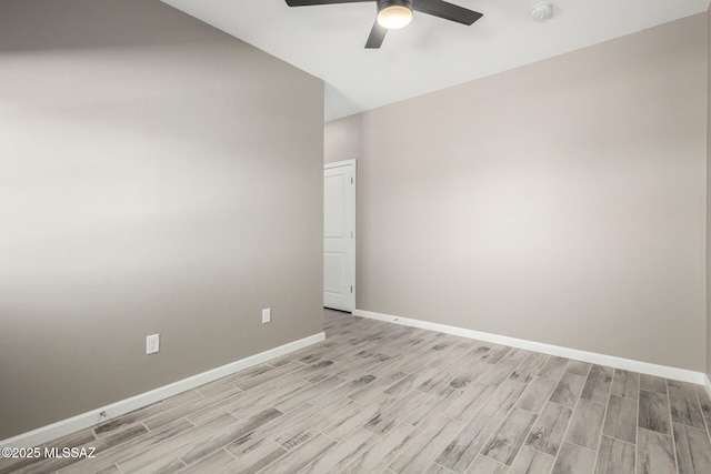 spare room with ceiling fan