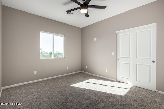 unfurnished bedroom with ceiling fan and carpet flooring