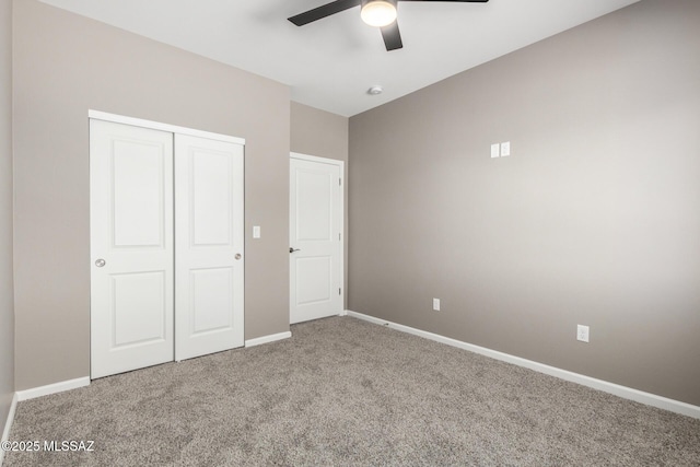 unfurnished bedroom featuring ceiling fan, carpet flooring, and a closet