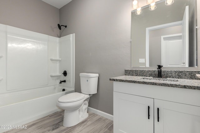 full bathroom with vanity, toilet, bathing tub / shower combination, and hardwood / wood-style floors