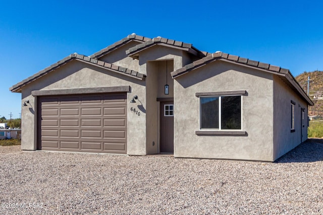 view of front of property with a garage