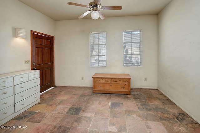 unfurnished bedroom featuring ceiling fan