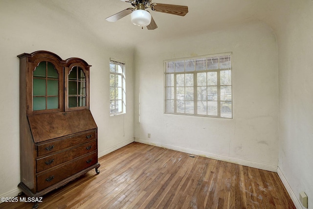 unfurnished room featuring light hardwood / wood-style floors and ceiling fan