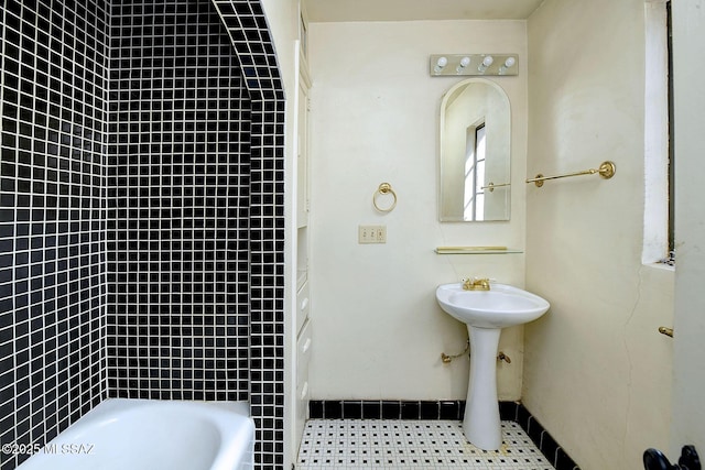 bathroom featuring a tub to relax in