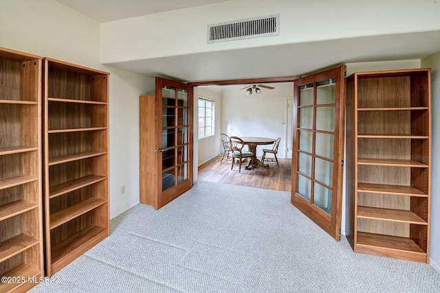 interior space with light colored carpet and french doors