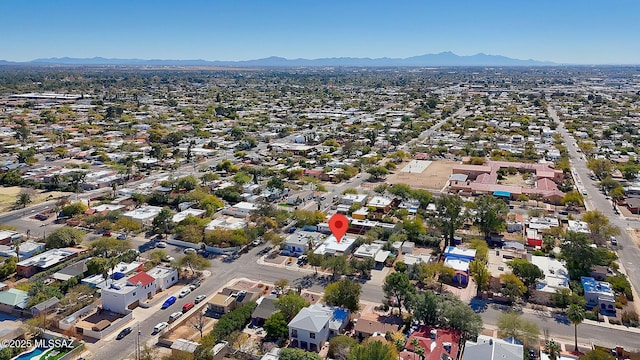 birds eye view of property featuring a mountain view