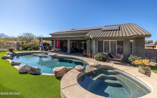 view of swimming pool with a yard and a patio area