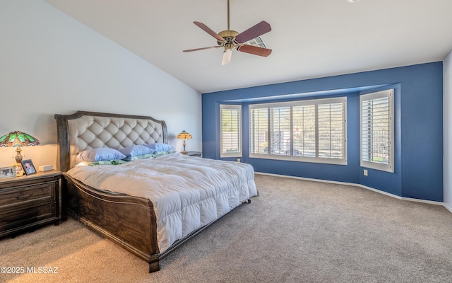 bedroom featuring vaulted ceiling, ceiling fan, and carpet flooring