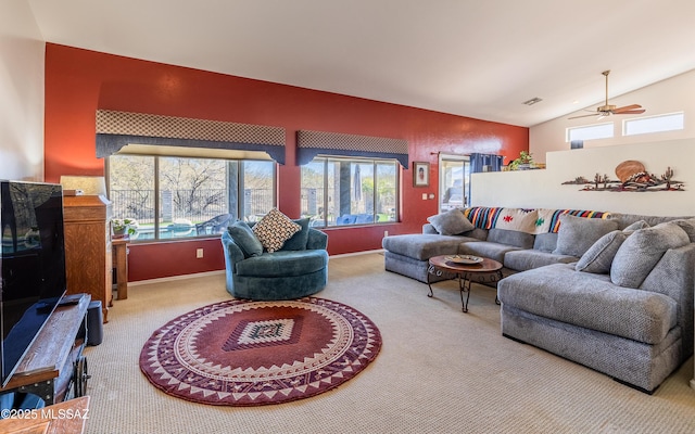 living room featuring lofted ceiling and carpet floors