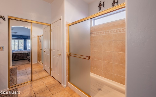 bathroom featuring an enclosed shower and tile patterned floors