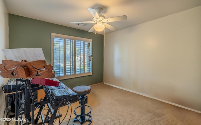 interior space featuring light carpet and ceiling fan