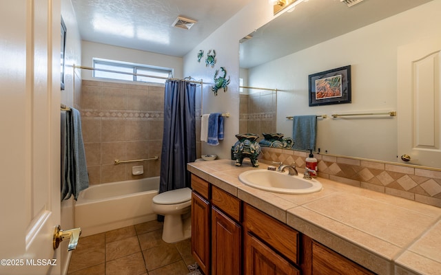 full bathroom featuring tile patterned flooring, vanity, shower / bathtub combination with curtain, and toilet