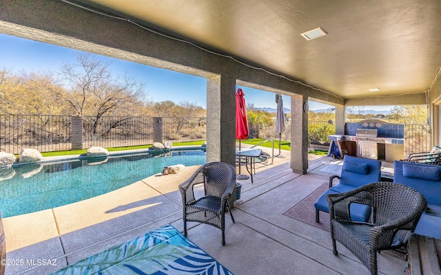 view of patio / terrace featuring a fenced in pool