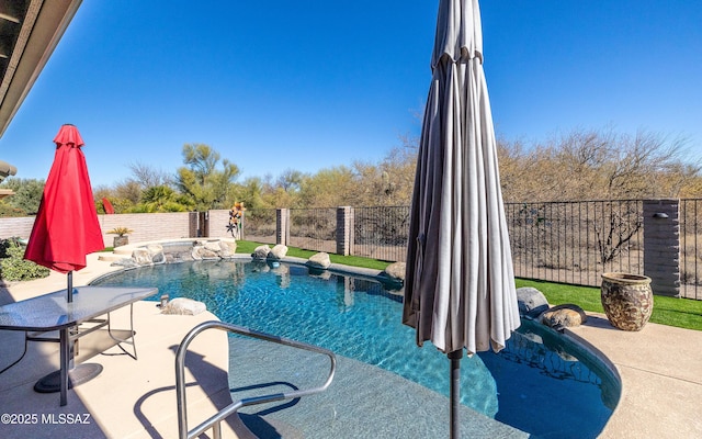 view of swimming pool with a patio area