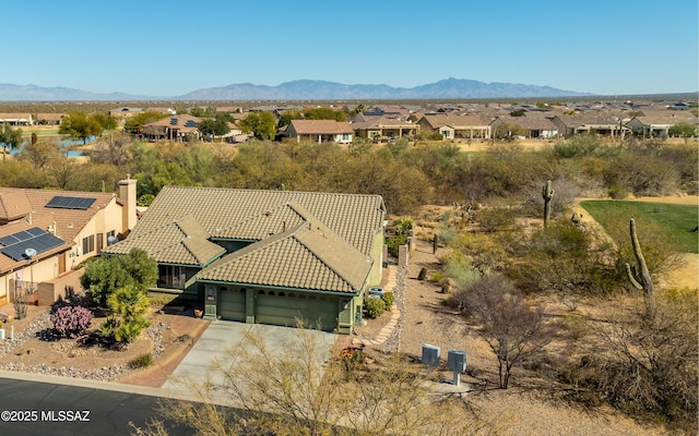 birds eye view of property with a mountain view