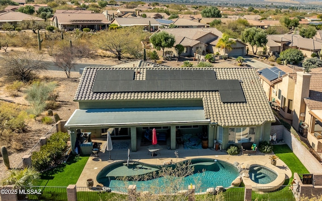 exterior space with a patio area and solar panels