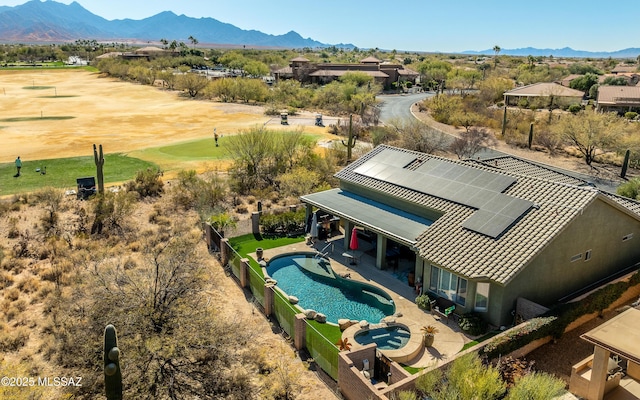 drone / aerial view featuring a mountain view