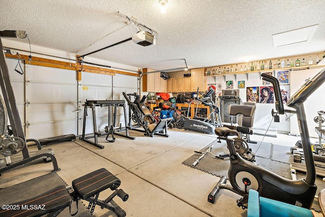 workout room featuring a textured ceiling