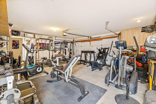 gym featuring a textured ceiling