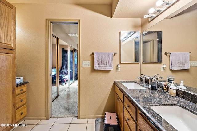 bathroom featuring vanity and tile patterned flooring