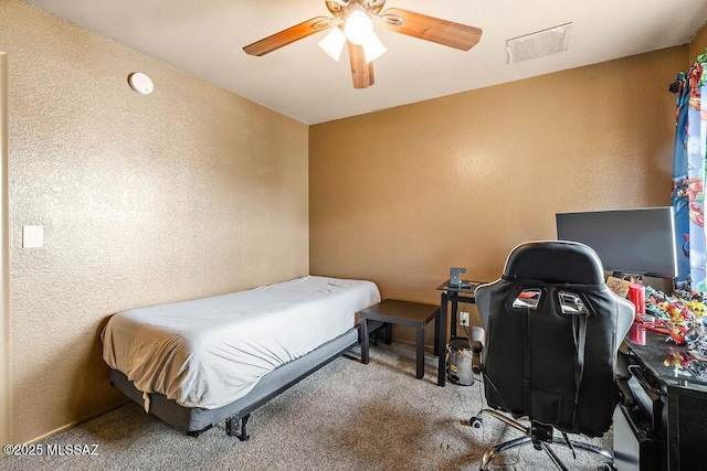 bedroom featuring ceiling fan and carpet flooring