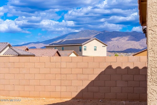 view of yard with a mountain view and fence