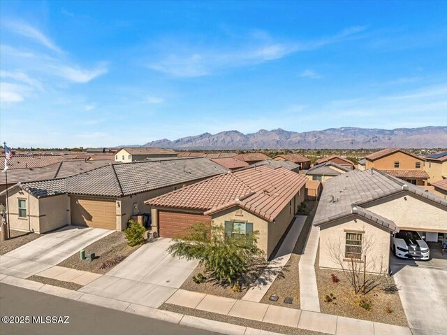 view of yard featuring fence and a mountain view