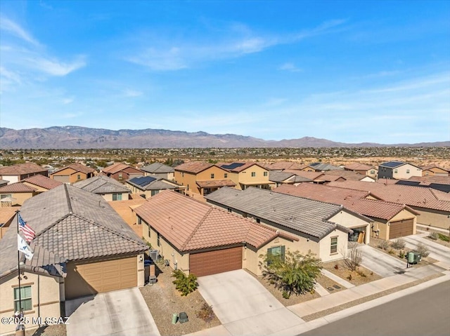 drone / aerial view with a residential view and a mountain view