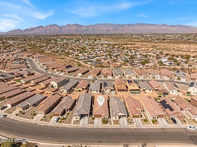 birds eye view of property featuring a mountain view and a residential view