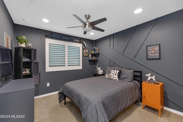 bedroom with light carpet and ceiling fan