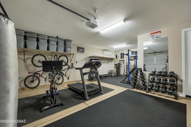 workout area featuring an AC wall unit