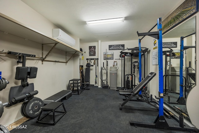 exercise room with a wall mounted AC